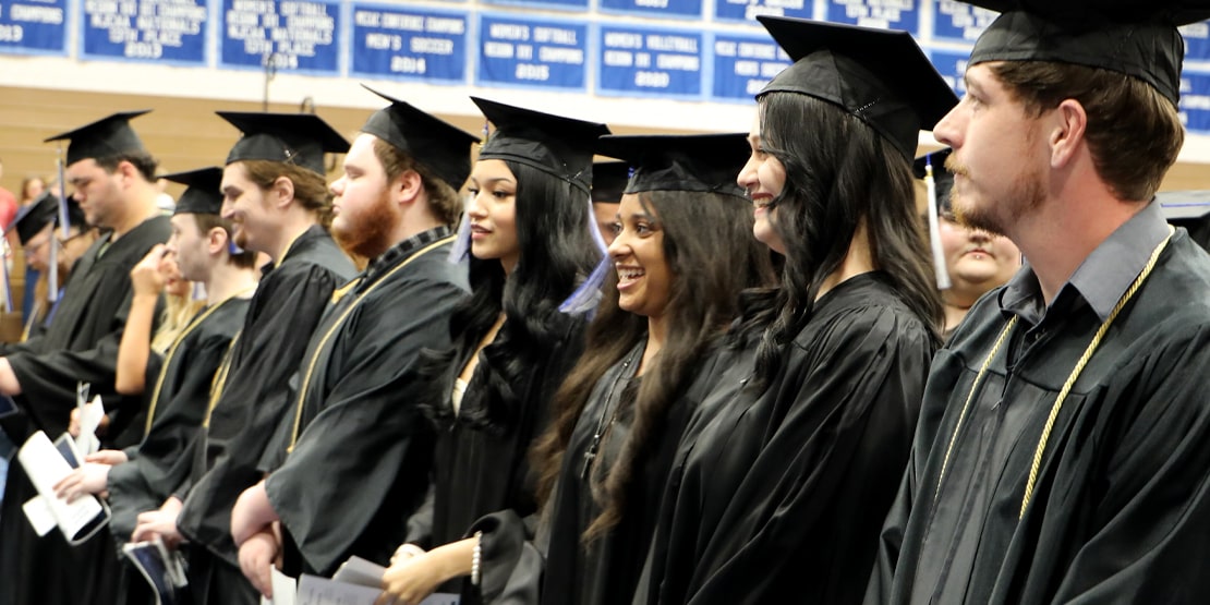 High school equivalency students seated during graduation