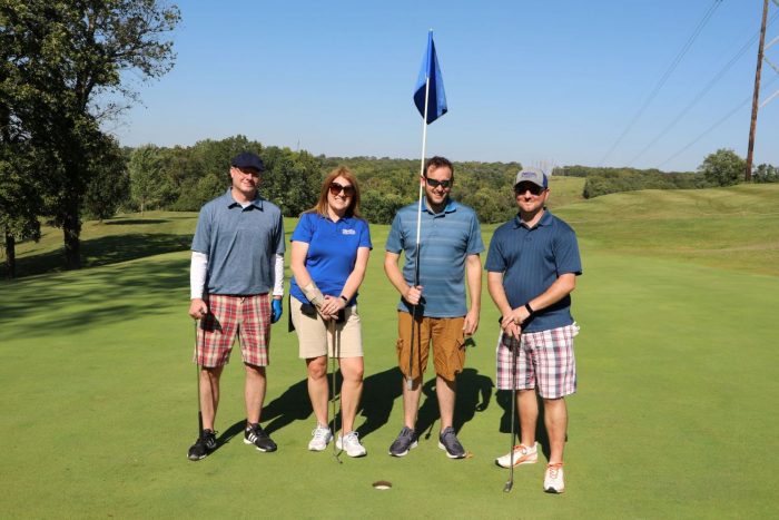 Golfers at hole