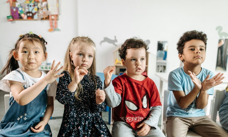 Children practicing sign language