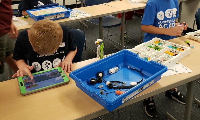 Young students working with robotics equipment