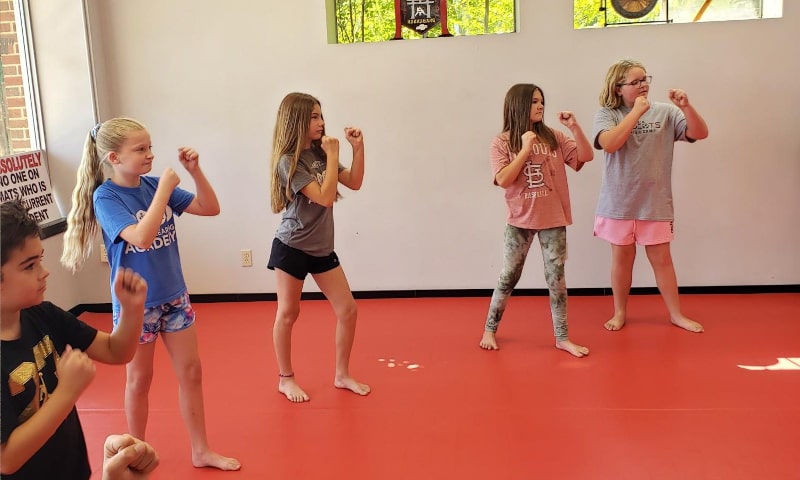 Young students practicing self-defense