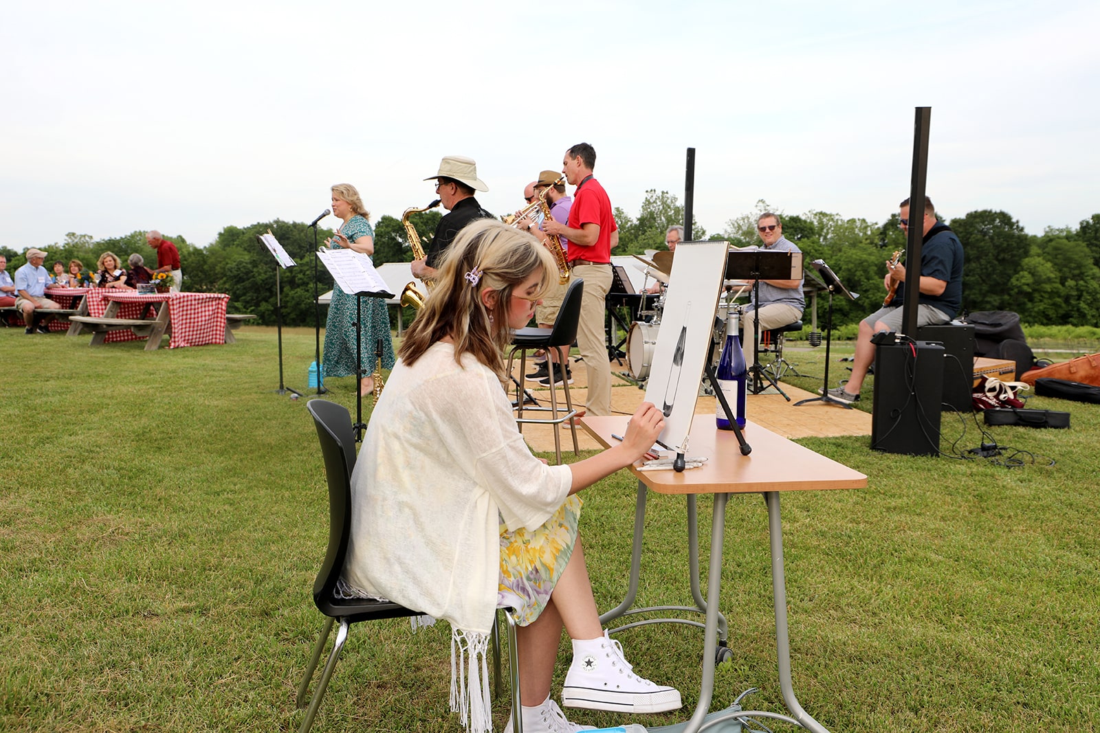 Art student painting at patrons kick-off