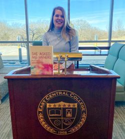 Katie Holtmeyer with her new book, "She Asked Me Where"