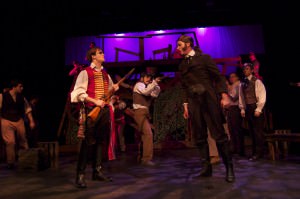 Theatre students performing play on stage
