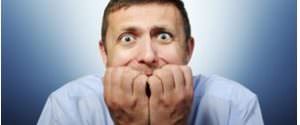 anxiety A man biting all his nails as if he was extrememly nervous