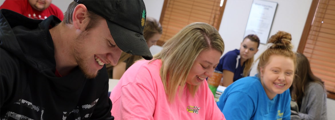 Students in class laughing