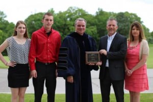 Anthony Kreutz; his daughter, Kaitlyn; son, Jacob; wife, Michelle; and ECC President Jon Bauer