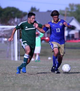 ECC sophomore Gavyn Prsha controls the ball against Maple Woods player