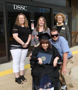 Group photo with Cookie and other students and staff from ECC