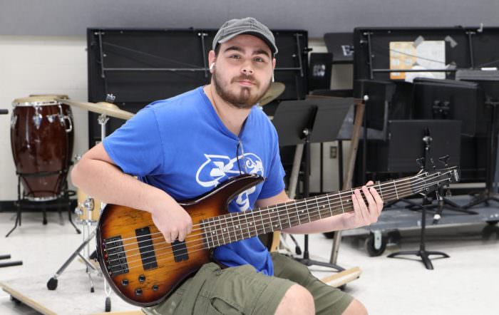 Music Student Teaches Bass Guitar and Performs on Stage