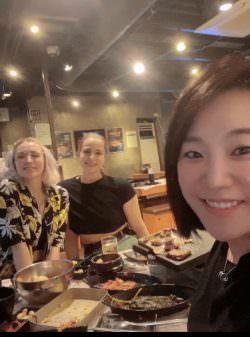 Kjia with others in restaurant