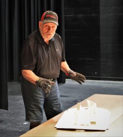 John Anglin with 3D model of set