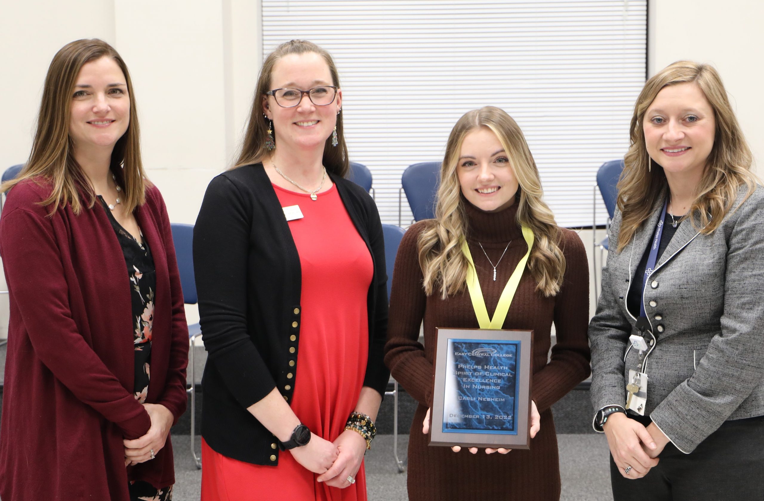 Joannie Blakely, Julie Chirban, Nesheim, and Kate Roy, posing with plaque.