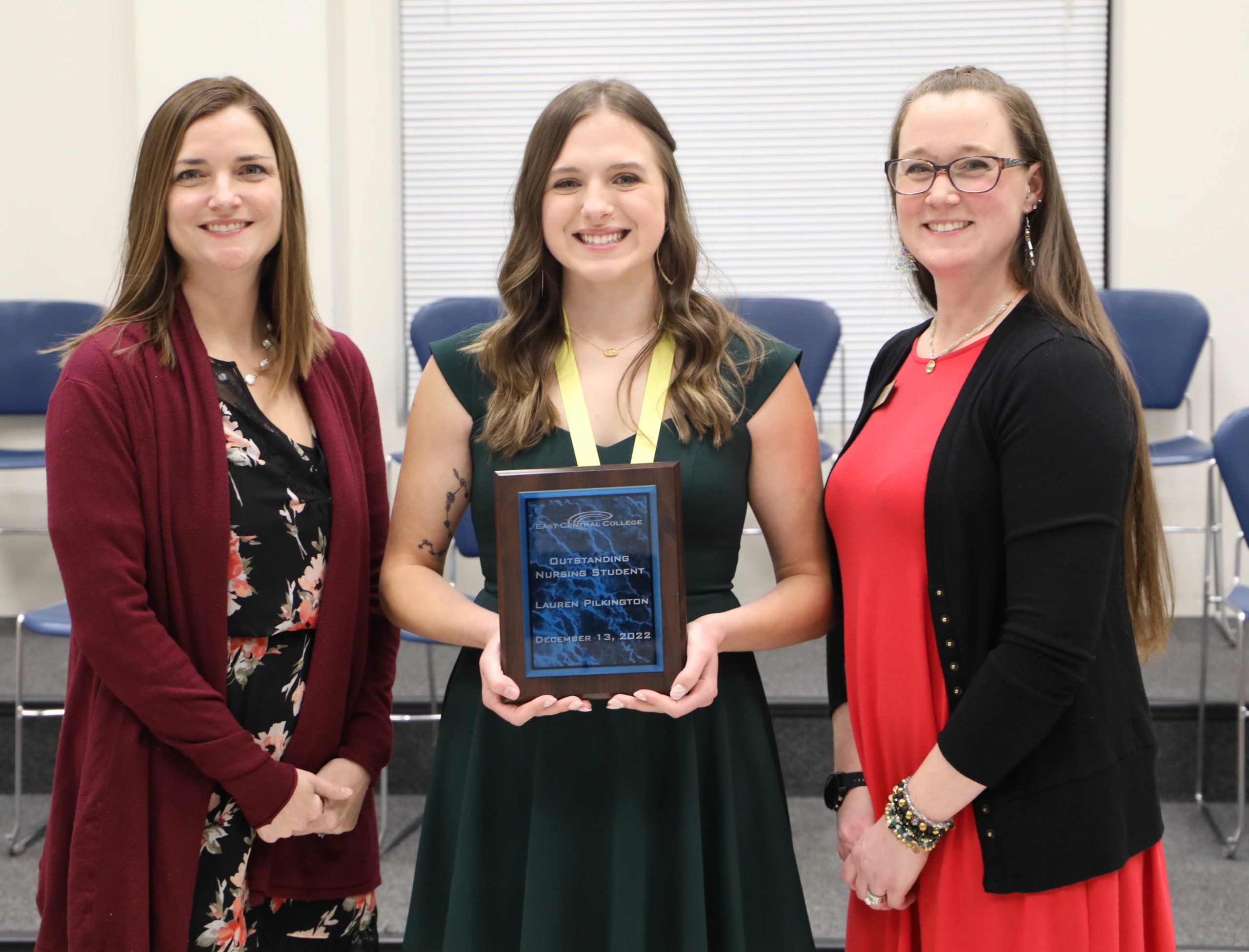Joannie Blakely, Julie Chirban, and Lauren Pilkington posing with plaque.