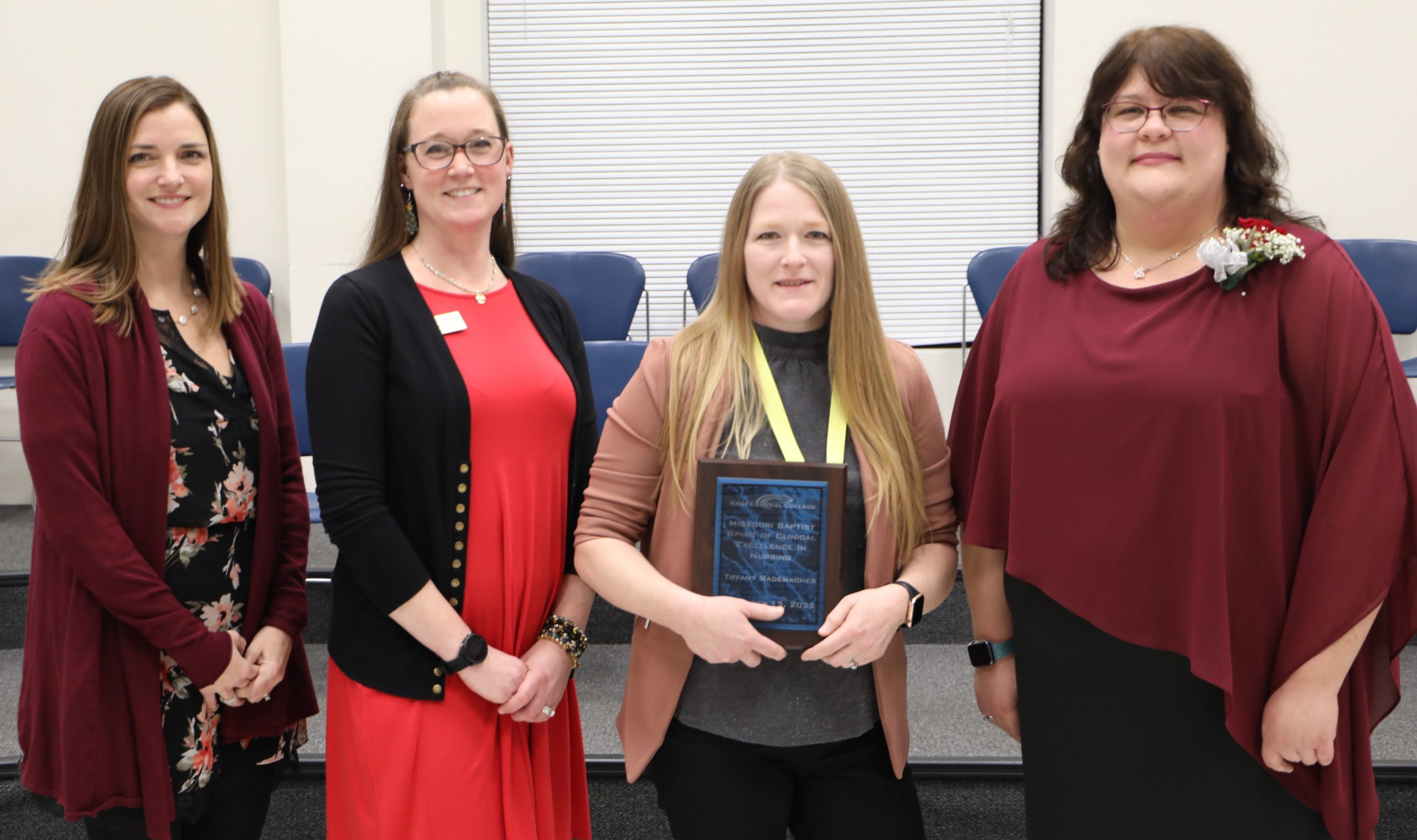 Joannie Blakely, Julie Chirban, Rademacher and Elisha Chaney posing with plaque.