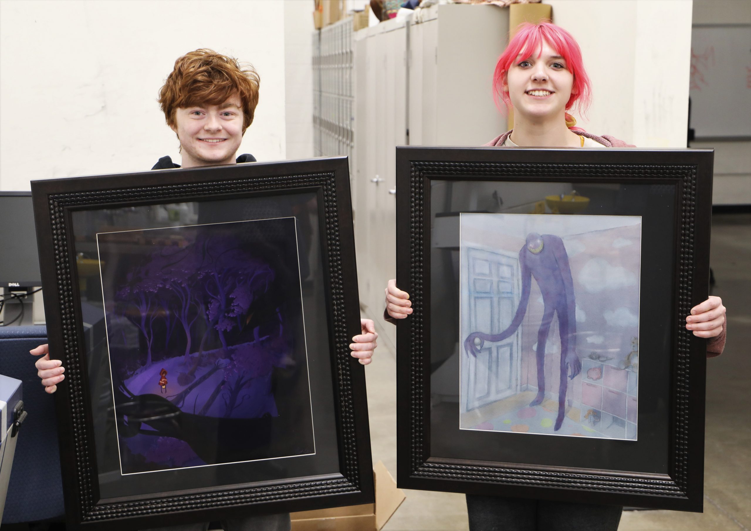 East Central College art students Milo Guile and Abby Stanfield with artworks