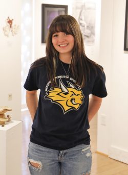 Parker Williamson standing in art gallery