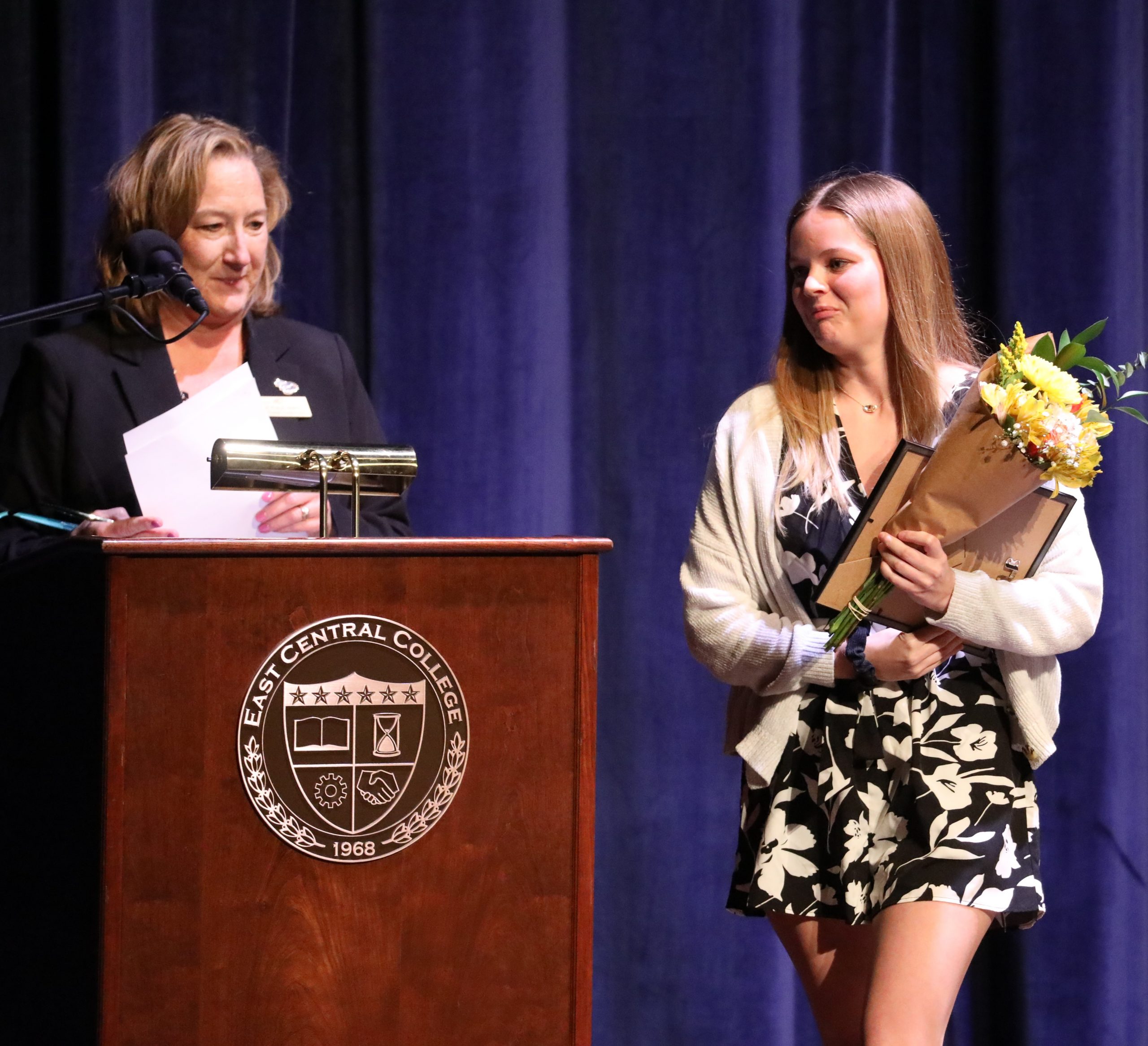 Vice President of Academic Affairs Dr. Robyn Walter at podium, announcing awards