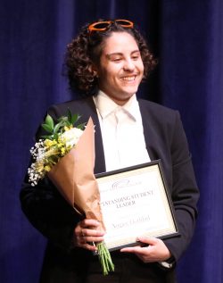 Augast Haddad accepting 2024 outstanding student leader award