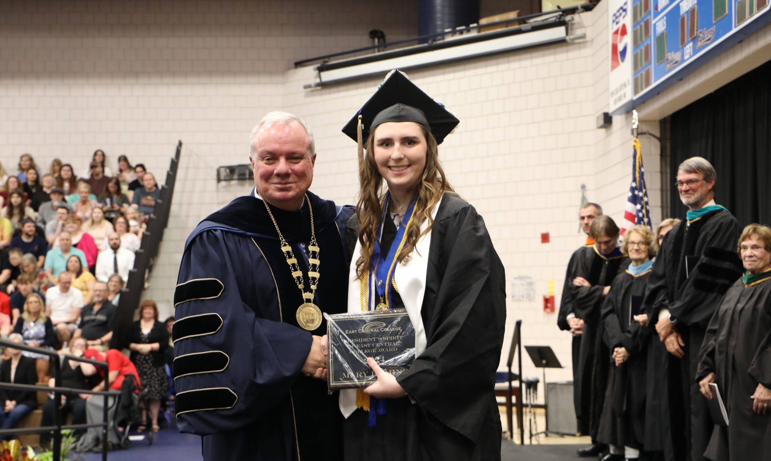 Student Mary Romine posing with Dr. Bauer during graduation
