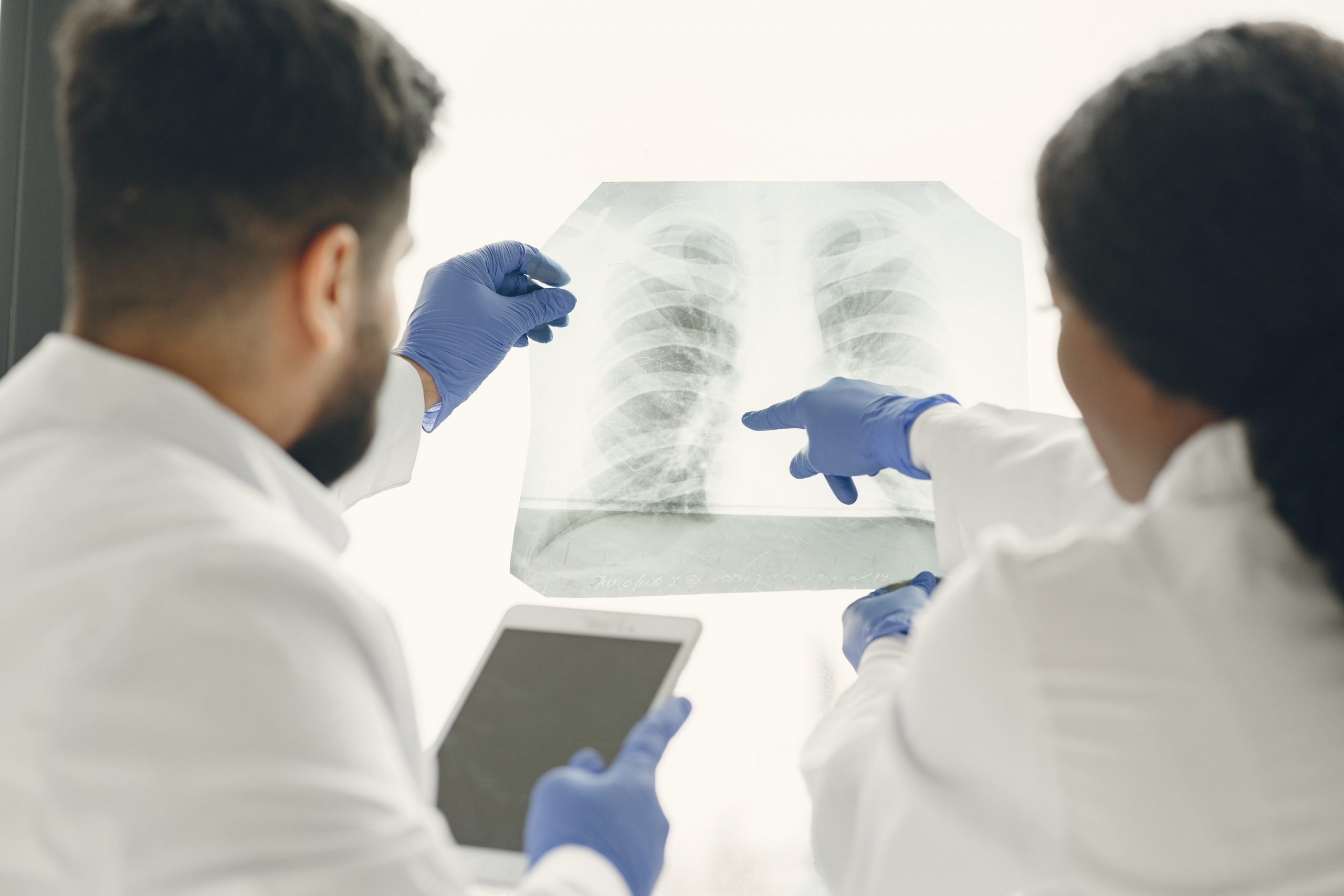 Doctors looking at patient's x-ray